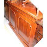 An early 20th century mahogany chiffonier base, twin raised panel doors to plinth support,