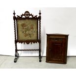 An Edwardian oak wall-hanging corner cupboard, floral carved frieze to single door,