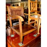 A nest of three mahogany tables, an Edwardian chair with bergère back rest to outswept arms,