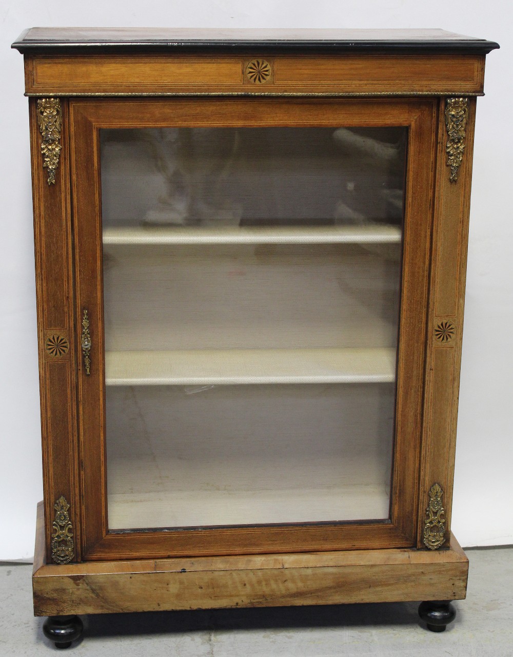 A 19th century mahogany inlaid single door display cabinet,