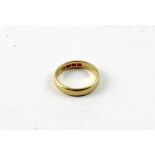 A 22ct gold wedding band, size N, approx 4.7g.