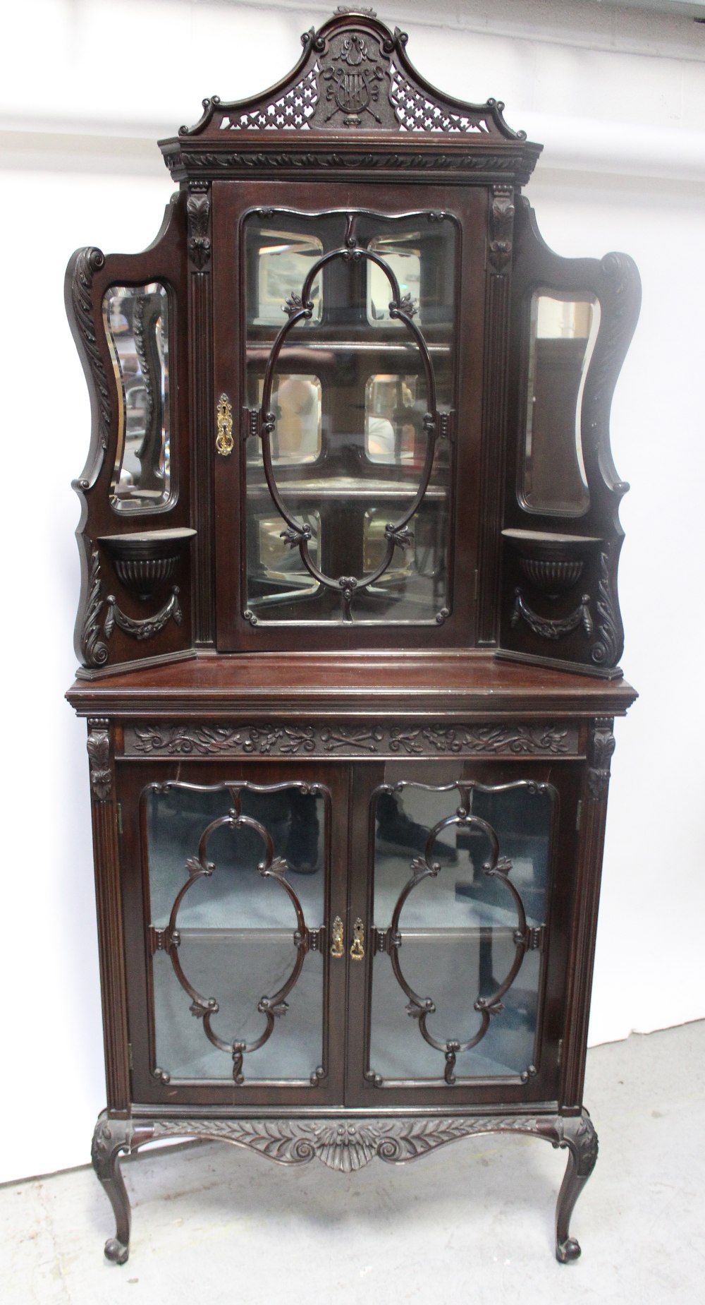 A 19th Century mahogany corner empire cabinet,