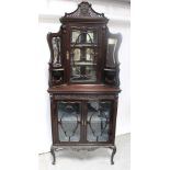 A 19th Century mahogany corner empire cabinet,