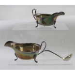 A pair of George V hallmarked silver sauce boats, Sheffield 1912 and a hallmarked silver ladle,