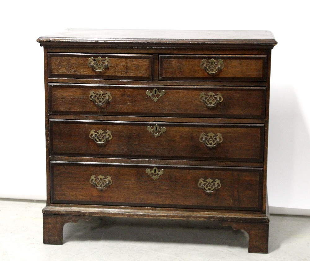 An early 19th century oak two-over-three chest of drawers on bracket supports, 84 x 91cm.