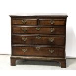 An early 19th century oak two-over-three chest of drawers on bracket supports, 84 x 91cm.