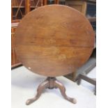 A Georgian mahogany snap-top table raised on tripod base, diameter 88cm.