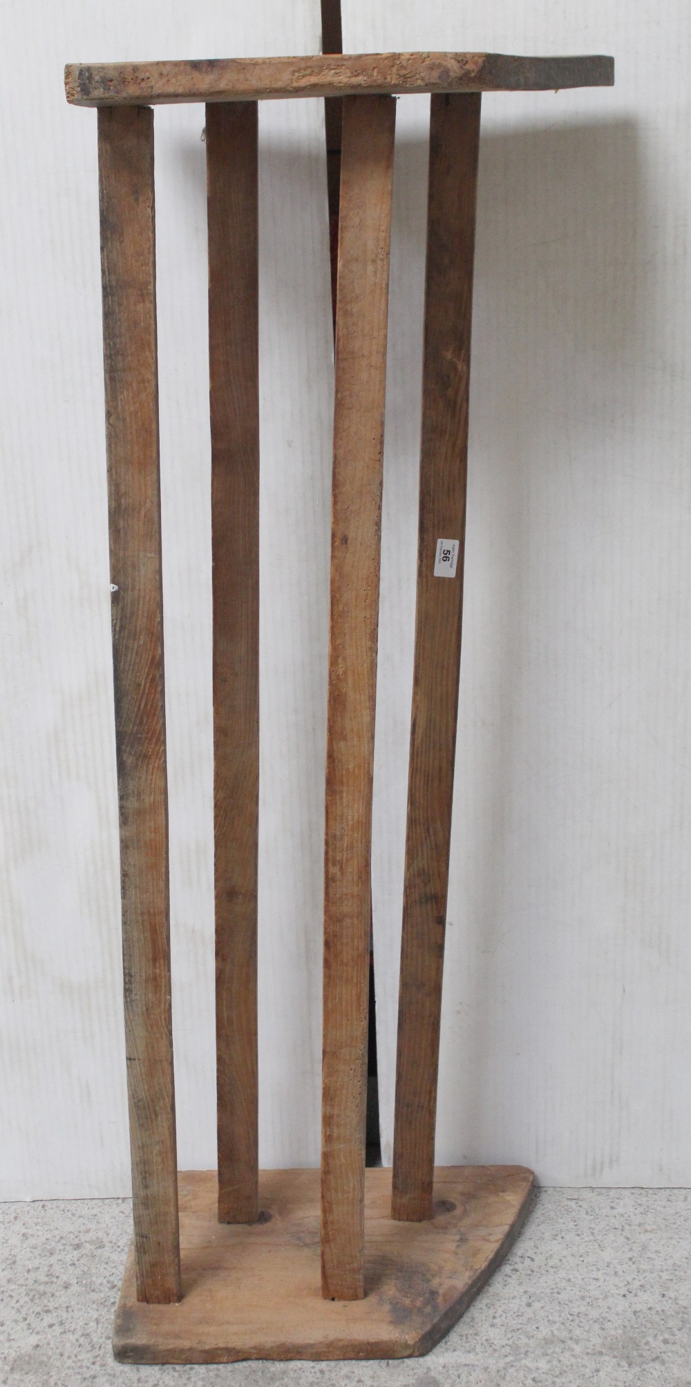 A long stripped pine two-tier boot/shoe rack with plank ends, length 128cm.