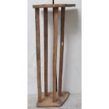 A long stripped pine two-tier boot/shoe rack with plank ends, length 128cm.