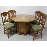 An octagonal oak and walnut inlaid dining table with octagonal central pillar base,