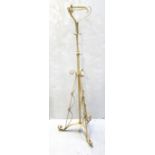 An Arts & Crafts painted metal adjustable oil lamp stand.
