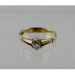 An 18ct yellow gold ladies' dress ring with solitaire diamond, size S, approx 3.9g.
