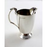 A George VI hallmarked silver cream jug of plain form, F H Adams & Holman, Birmingham 1937,