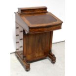 A 19th century mahogany Davenport with bird's-eye maple and walnut inlay,