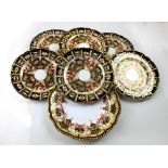 Four Royal Crown Derby matching plates in the Imari palette and two Royal Crown Derby matching