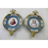 A pair of late 19th century Sevres porcelain cabinet plates pained with portraits of King Louis XVI