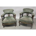 A pair of mahogany-framed tub chairs, curved arm rests to squat cabriole supports and peg feet (2).