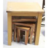 A nest of three mango wood tables, largest 49 x 29cm,