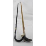 An ebonised walking cane embellished with gold-plated tip and collar and a homemade stick with