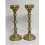 A pair of large Neo-Gothic brass candlesticks, height 46cm.