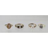 Four 9ct gold ladies' dress rings to include a ring with three opals and small garnets,