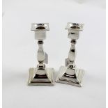 A pair of Edward VII hallmarked silver candle sticks, Mappin & Webb, Birmingham 1910,