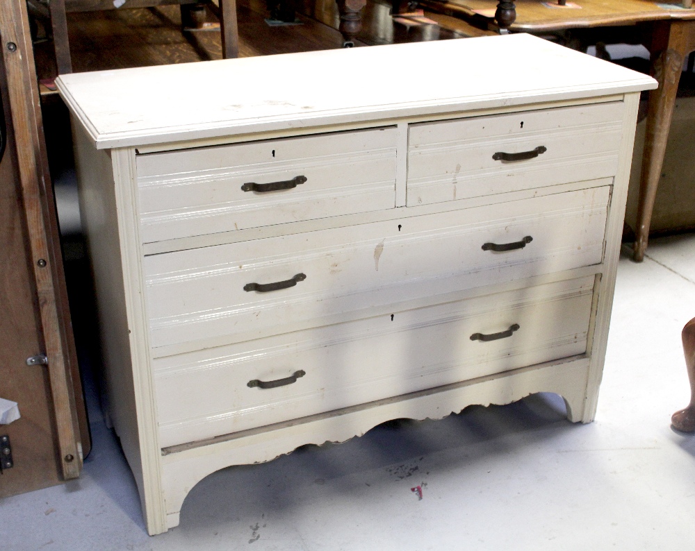 An early 20th century cream painted two-over-two chest of drawers to shaped plinth base,