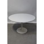 A c1960s Arkana Tulip dining table by Maurice Burke, raised on white pedestal, marked to base,