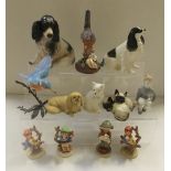 A small group of Goebles figures to include boys and girls, a large dog,