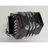 A modern Scarlatti C/G Anglo concertina, twenty button in C/G, black pearl, plastic buttons.