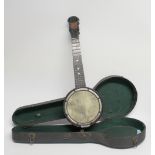 An early 20th century Vintage cased 'The Merry-Bright' four string Ukulele Banjo or Banjolele in