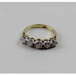 An 18ct yellow gold graduated five-stone diamond ring, central stone approx 0.