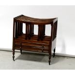 A late 19th/early 20th century mahogany Canterbury to slender tapering supports and small castors.