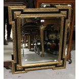 A black and gilt framed wall mirror in the Napoleonic style, 85 x 75cm.