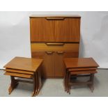 Two near-matching nests of G-plan style side tables and a contemporary Uniflex teak-style bureau,