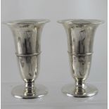 A pair of George V hallmarked silver trumpet-form posy vases maker's marks rubbed, London 1922,