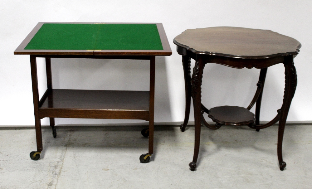 An Edwardian mahogany fold-over card table and a similar period circular occasional table (2).