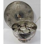 A large plated circular tray with gallery rim and chased decoration, diameter 57cm,