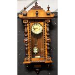 An early 20th century mahogany-cased Vienna-style eight-day wall clock,