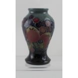 A modern Moorcroft 'Finches' vase with date stamp 1994, height 10cm.