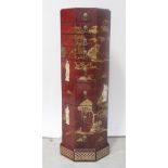 An Oriental red lacquered octagonal chest of eight drawers with gilt detail,