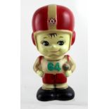 A c1950s Japanese Tatung American boy footballer number 64 money box, height 19.5cm.