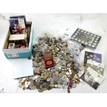 A large collection of British and world coinage to include Royal Mint commemorative sets and a