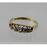 An 18ct yellow gold ladies' dress ring with five graduating diamonds, size Q, approx 3.3g.