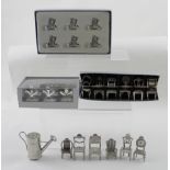 Various table place setting to include three boxed sets, various styles white metal chairs, cutlery,