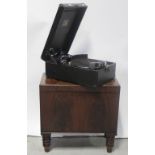 An early 20th century 'His Master's Voice' portable black cased gramophone and an early/mid 20th