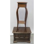 A modern reproduction small oak cabinet and a mahogany square-top plant stand with cabriole legs