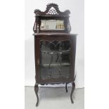 A 19th century mahogany mirror-back music cabinet,