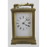 A 19th century French brass-cased repeating carriage clock, the dial set with Roman numerals,