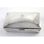 A George VI hallmarked silver cigarette box with cushion lid engraved 'Presented to Captain CGC